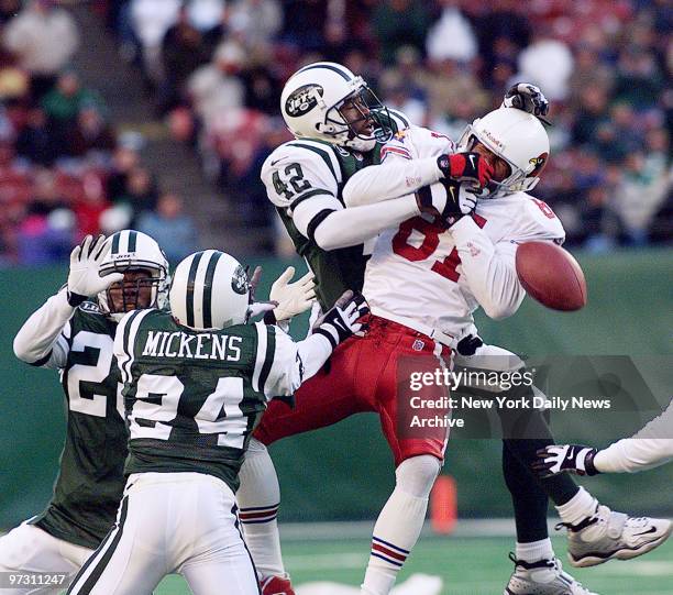 New York Jets' Marcus Coleman breaks up a third down pass to Arizona Cardinals' Frank Sanders late in the fourth quarter of game at Giants Stadium.
