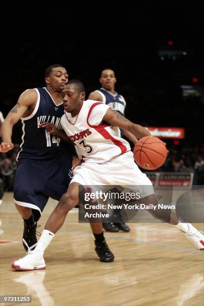 St. John's Daryll Hill is defended by the Villanova Wildcats' Allan Ray during second half of game at Madison Square Garden. Hill scored 31 points,...