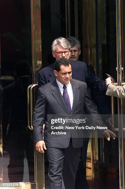 Juan Miguel Gonzalez is followed by his lawyer, Greg Craig, as he walks to news conference in Washington after a federal appeals court in Atlanta...