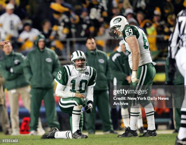 New York Jets' offensive tackle Jason Fabini looks on as quarterback Chad Pennington screams after being sacked during the first half of the AFC...