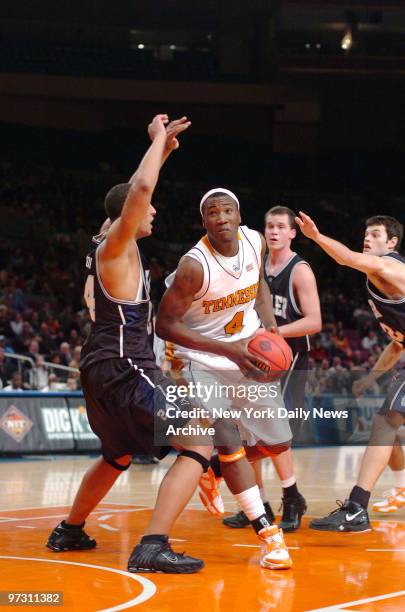 Tennessee Volunteers Wayne Chism drives to the basket during the National Invitation Tournament Season Tip-Off semifinals game against the Butler...