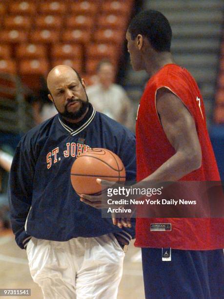 St. John's head coach Mike Jarvis has a word with Ron Artest during a practice session for the NCAA tournament.