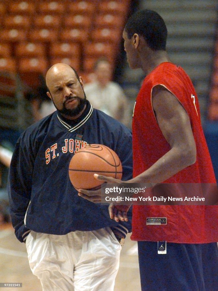 St. John's head coach Mike Jarvis has a word with Ron Artest