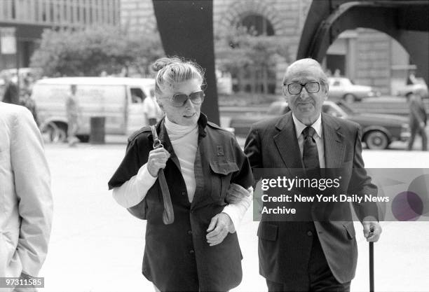 Katharine Hepburn with Joseph Levine headed for lunch.