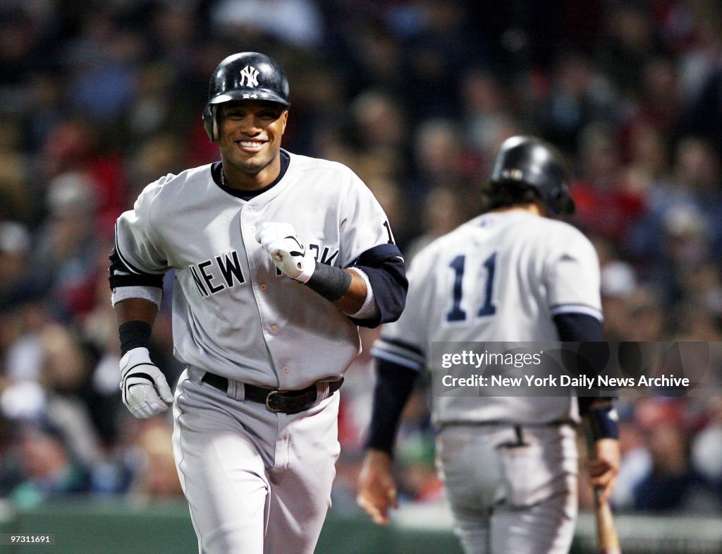 New York Yankees' Robinson Cano is all smiles as he jogs bac
