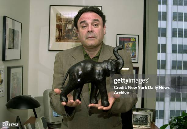 Gil Schwartz, Executive Vice President of Communications for CBS television holds his elephant. He is the author of a new book, "Throwing the...