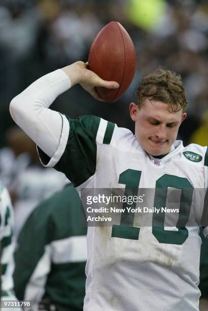 New York Jets' quarterback Chad Pennington throws a ball into the turf while on the sidelines after the Oakland Raiders scored in the fourth quarter...