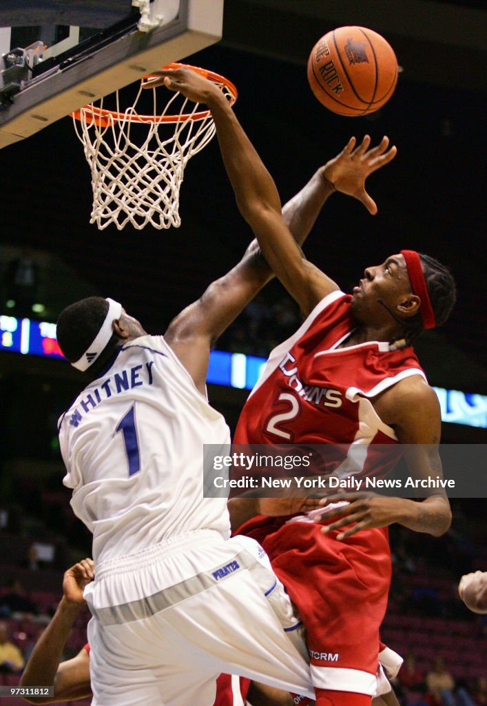St. John's Red Storm's Anthony Mason Jr. shoots but is block