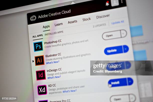 Adobe Systems Inc. Creative Cloud application icons are displayed on a computer monitor in an arranged photograph taken in Tiskilwa, Illinois, U.S.,...