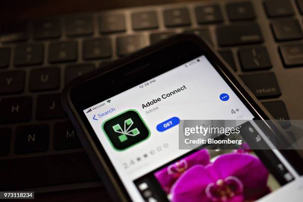 The Adobe Systems Inc. Connect application is displayed in the App Store on an Apple Inc. IPhone in an arranged photograph taken in Tiskilwa,...
