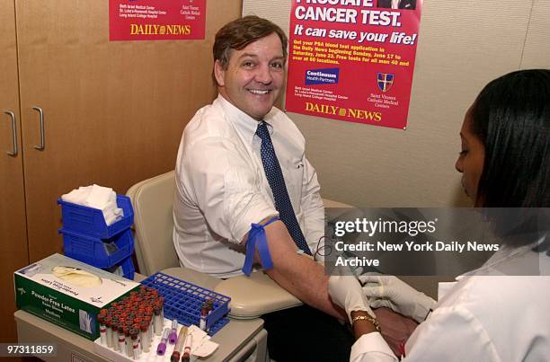 David Campbell, president and CEO of St. Vincent's Medical Center, gets his free prostate cancer screening as part of a free Father's Day gift - a...