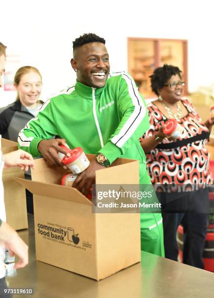 Player Antonio Brown helps pack up and donate 5,000 bowls of Campbell's Chunky Soup for the Pittsburgh Food Bank on June 12, 2018 in Pittsburgh, PA.