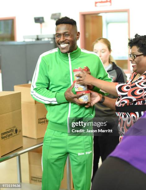 Player Antonio Brown helps pack up and donate 5,000 bowls of Campbell's Chunky Soup for the Pittsburgh Food Bank on June 12, 2018 in Pittsburgh, PA.