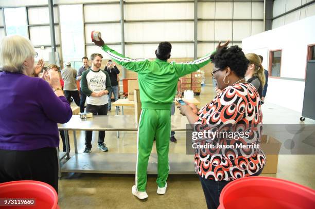 Player Antonio Brown helps pack up and donate 5,000 bowls of Campbell's Chunky Soup for the Pittsburgh Food Bank on June 12, 2018 in Pittsburgh, PA.