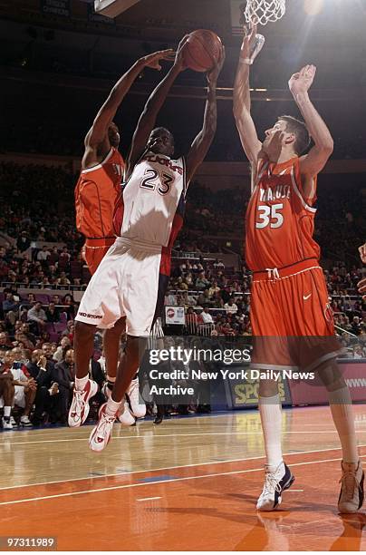 St. John's Willie Shaw drives toward the basket as Syracuse's Billy Celuck defends at Madison Square Garden. The Red Storm ended its regular season...