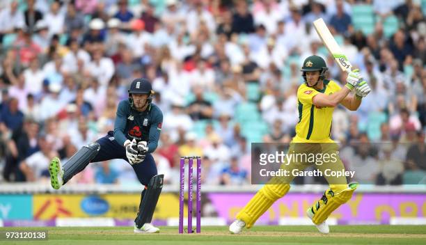 Australia captain Tim Paine bats watched by England wicketkeeper Jos Buttler during the 1st Royal London ODI match between England and Australia at...
