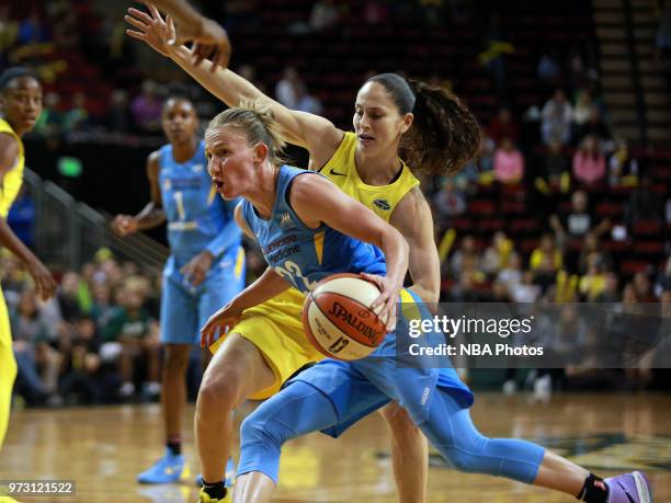 Guard Courtney Vandersloot of the Chicago Sky handles the ball during the game against the Seattle Storm on June 12, 2018 at KeyArena in Seattle,...