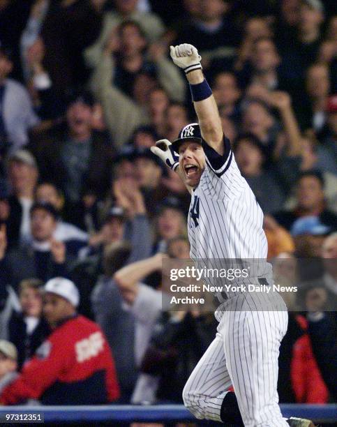 New York Yankees' Scott Brosius throws his hands in the air after hitting a two-out, two-run, game-tying homer in the ninth inning of Game 5 of the...