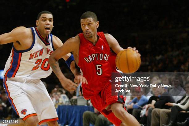 Toronto Raptors' Jalen Rose drives to the basket around New York Knicks' Allan Houston during game at Madison Square Garden. The Knicks beat the...