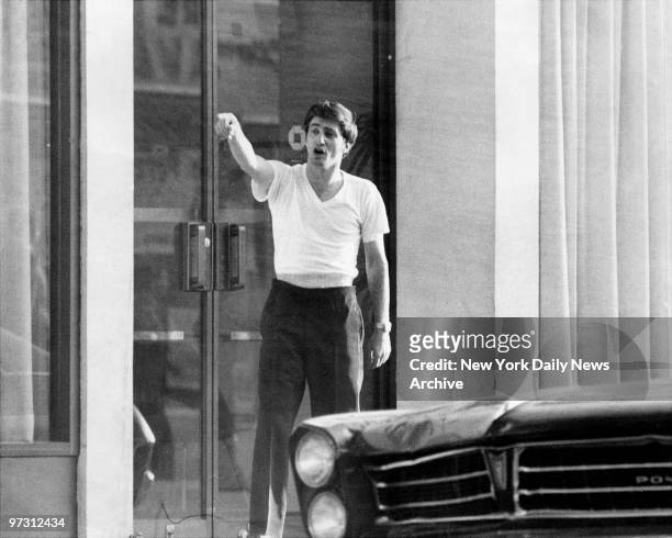 John Wojtowicz, bank robber, comes out of Chase Manhattan branch at 450 Avenue P in Bensonhurst, Brooklyn to talk to police..