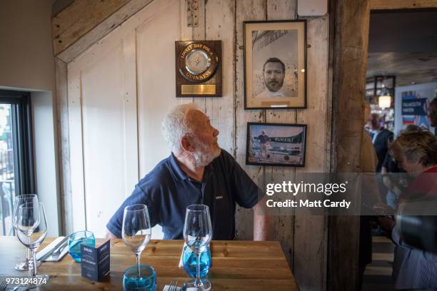 Sir Robin Knox-Johnston poses for a photograph in the Chain Locker public house besides the harbour in Falmouth on June 13, 2018 in Cornwall,...