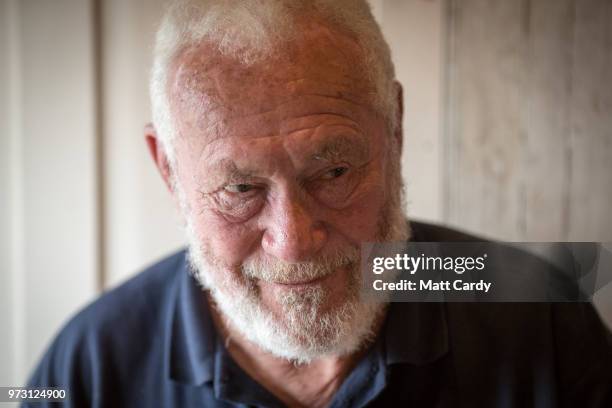 Sir Robin Knox-Johnston poses for a photograph as he is served a steak meal in the Chain Locker public house besides the harbour in Falmouth on June...