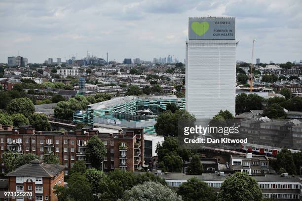 Sign with 'Grenfell Forever In Our Hearts' is displayed on the top of Grenfell Tower on June 13, 2018 in London, England. Tomorrow marks the one year...