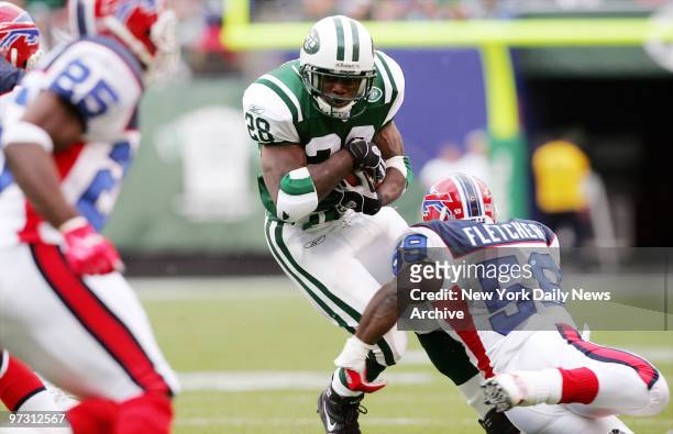 New York Jets' running back Curtis Martin carries the ball in the first quarter against the Buffalo Bills at Giants Stadium. The Jets won, 16-14, for...