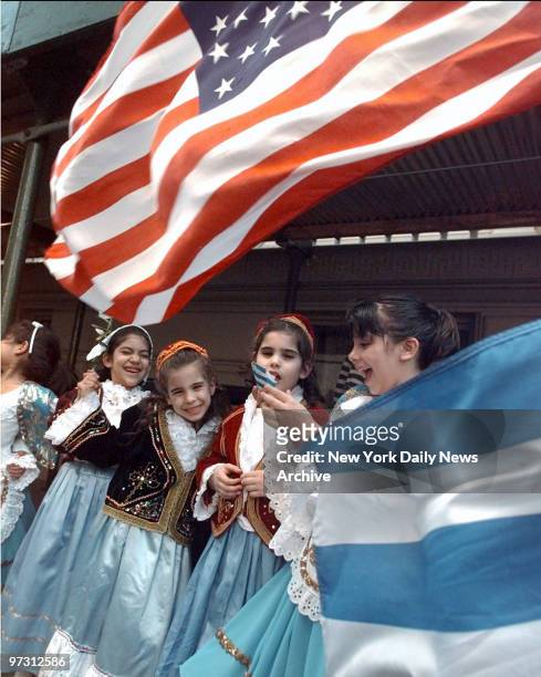 Girls in traditional costume get ready to march in Greek Independence Day Parade.