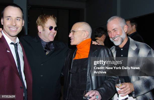 David Furnish , Elton John, Larry Kramer and his partner at the amFAR and ACRIA Benefit Honoring Herb Ritts held at Sotheby's