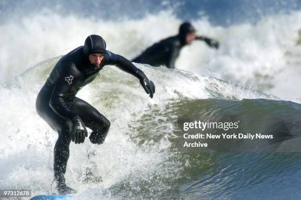 Surfers take to the waves at Beach 90th St. In the Rockaways. The new "surfing only" portion of the beach lies between jetties on Beach 87th and...