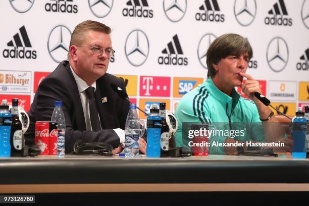 Reinhard Grindel , President of the Germany Football National Federation talks to the media next to Joachim Loew, head coach of Germany during the...