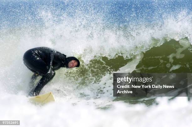 Surfers take to the waves at Beach 90th St. In the Rockaways. The new "surfing only" portion of the beach lies between jetties on Beach 87th and...