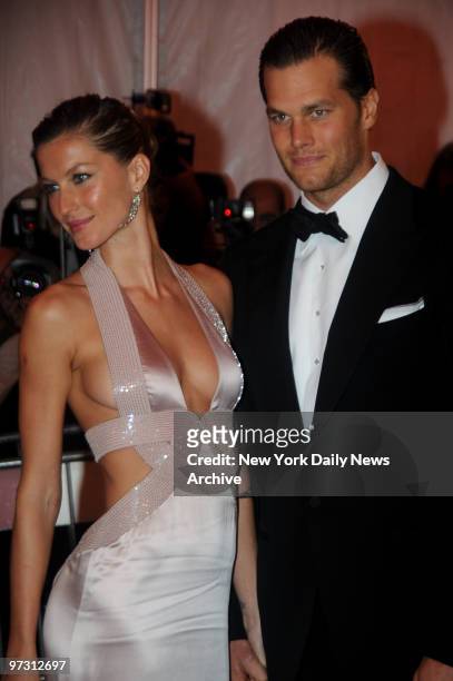 Gisele Bundchen and Tom Brady at the Costume Institute Gala celebrating Superheroes:Fashion and Fantasy .. And held at the Metropolitan Museum of Art