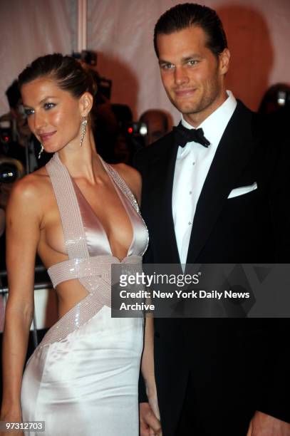 Gisele Bundchen and Tom Brady at the Costume Institute Gala celebrating Superheroes:Fashion and Fantasy .. And held at the Metropolitan Museum of Art