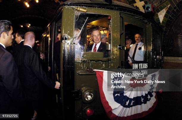 Mayor Michael Bloomberg takes the controls, just as Mayor George McClellan did in 1904 on the New York subway's first run from the old City Hall...