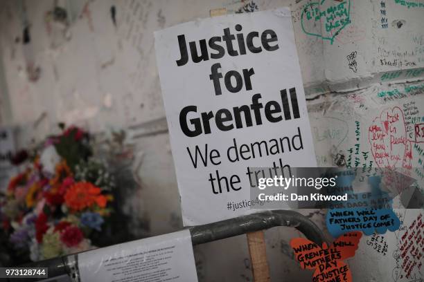 Sign stating 'Justice for Grenfell' is left at a vigil near Grenfell Tower on June 13, 2018 in London, England. Tomorrow marks the one year...