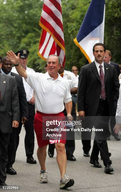 Mayor Michael Bloomberg waves as he marches in the 96th Independence Day Parade on Victory Blvd. In Staten Island.