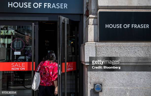 Customer enters a House of Fraser store, one of the stores slated for closure, on King William Street in the City of London, U.K., on Wednesday, June...