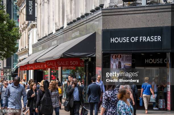 Pedestrians pass a House of Fraser store, one of the stores slated for closure, on Oxford Street, in central London, U.K., on Wednesday, June 13,...