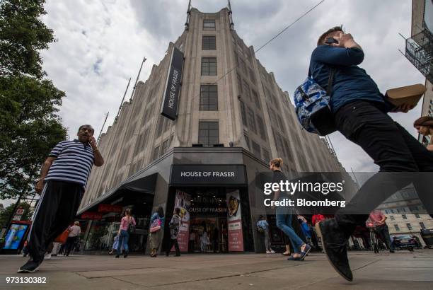 Pedestrians pass a House of Fraser store, one of the stores slated for closure, on Oxford Street, in central London, U.K., on Wednesday, June 13,...