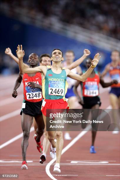 Hicham El Guerrouj of Morocco crosses the finish line first to win a gold medal in the men's 1500-meters at the 2004 Summer Olympic Games in Athens.