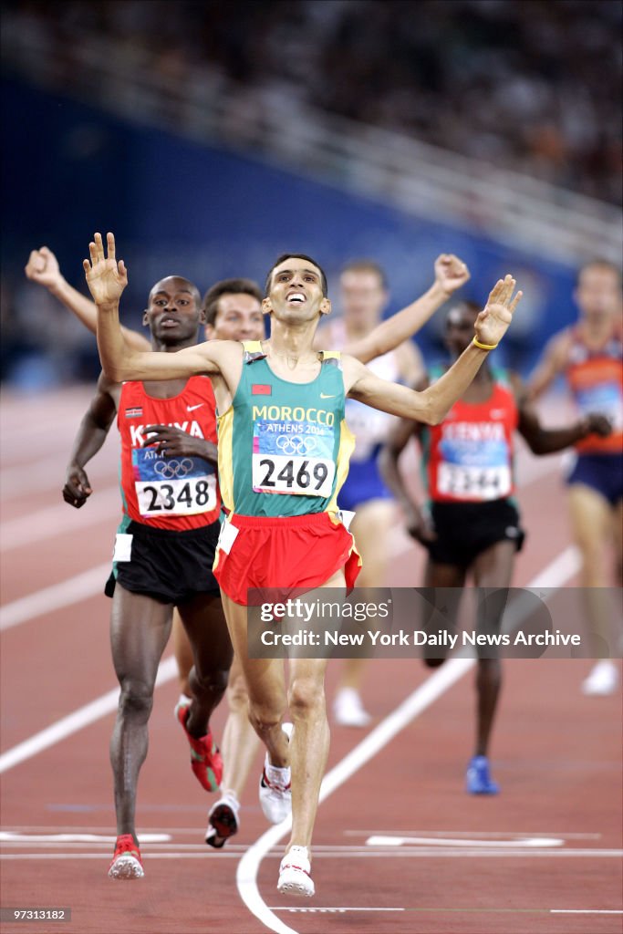 Hicham El Guerrouj of Morocco crosses the finish line first