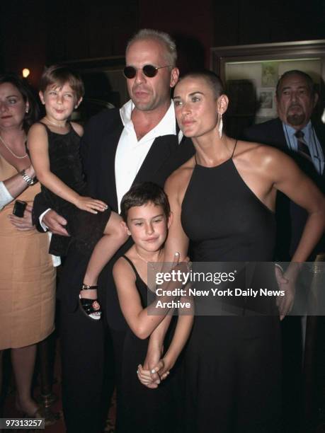 Demi Moore and Bruce Willis with daughters, Rumer and Scout, attending premiere of movie "Striptease" at the Ziegfeld Theater.