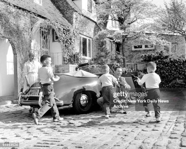 Johnny Carson and his family at his home, Birch Hill Estate, Winfield Ave, Harrison, N.Y. Arriving home after his afternoon TV show, Johnny drives...