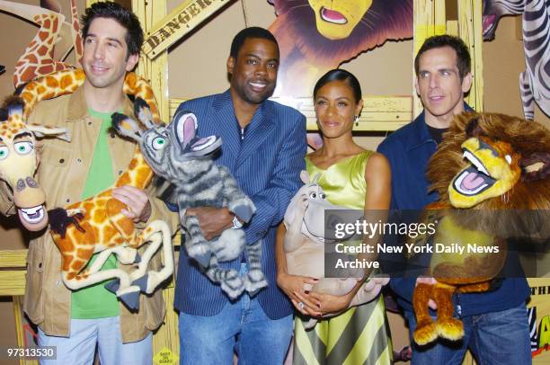 David Schwimmer, Chris Rock, Ben Stiller and Jada Pinkett Smith hold the stuffed characters they portray at the New York premiere of the animated...