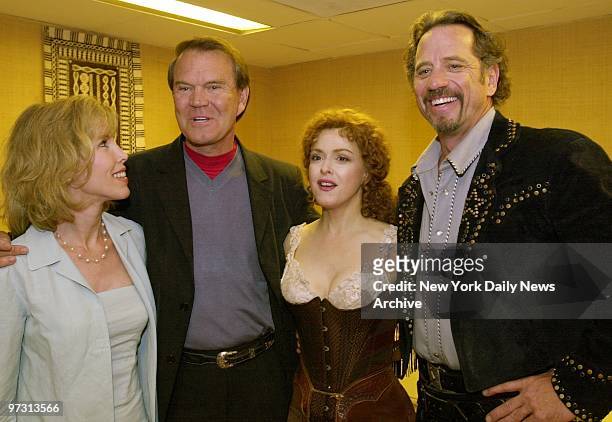 Glenn Campbell and wife Kim get together with Bernadette Peters and Tom Wopat backstage at the Marquis Theater, where Peters and Wopat are starring...