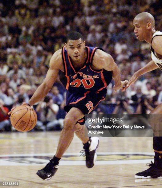 New York Knicks' Allan Houston drives around Indiana Pacers' Reggie Miller during Game 2 of the Eastern Conference finals at Market Square Arena.