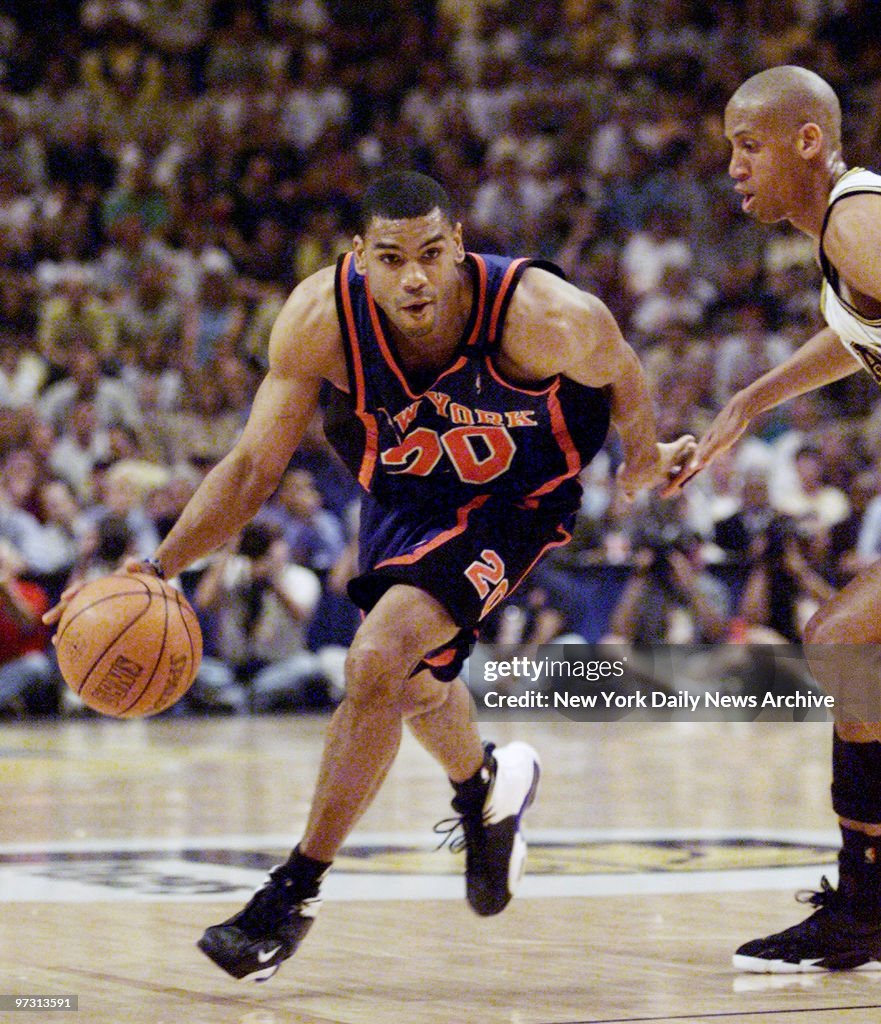 New York Knicks' Allan Houston drives around Indiana Pacers'