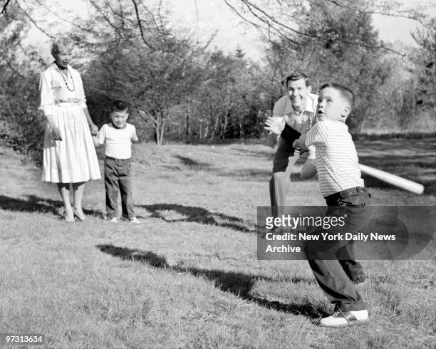 Johnny Carson and his family at his home, Birch Hill Estate, Winfield Ave, Harrison, N.Y. Time for baseball, Johnny plays some baseball with his sons.